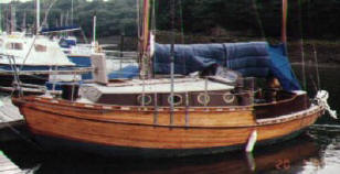 'Chris Hawk' 24'  Strip planked mahogany, the deck is marine ply and the interior is varnished mahogany and ply. 