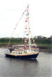 Mr. Norman Garnett, Jean, an E. 24 on launching Day April 2002. Douglas Boatyard R. Ribble.